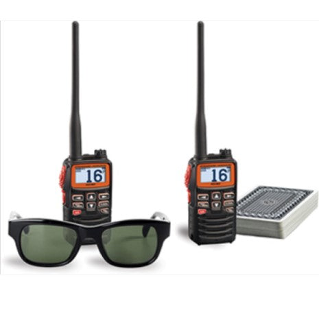 Radios next to a pair of glasses and cards